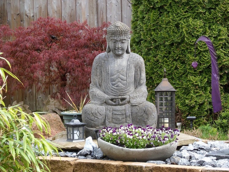 zen garden with buddha statue