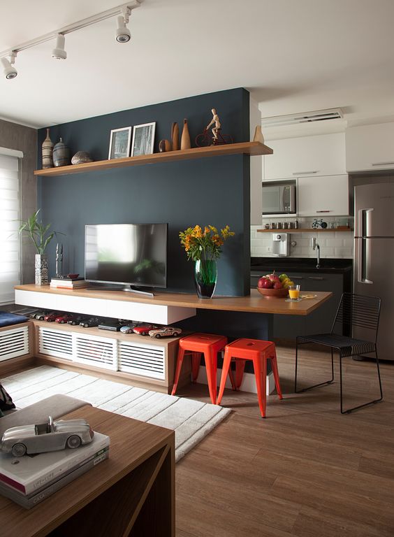 Navy blue living room wall in small apartment.