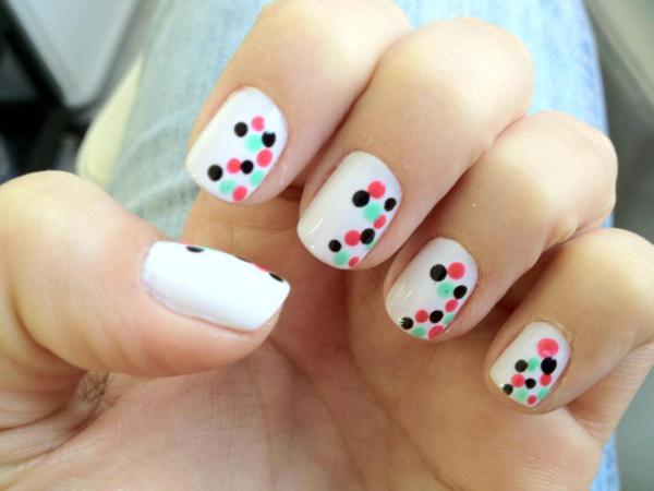 Nail model decorated with polka dots