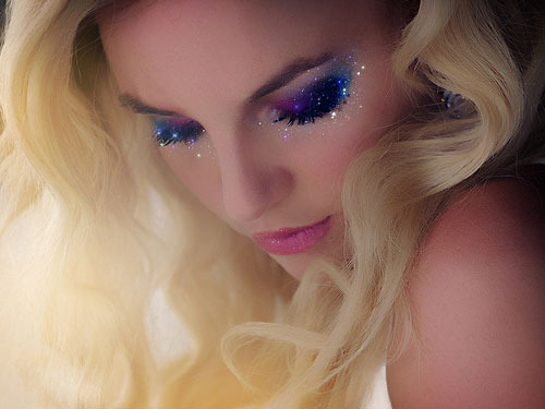 Blonde woman wearing glitter makeup