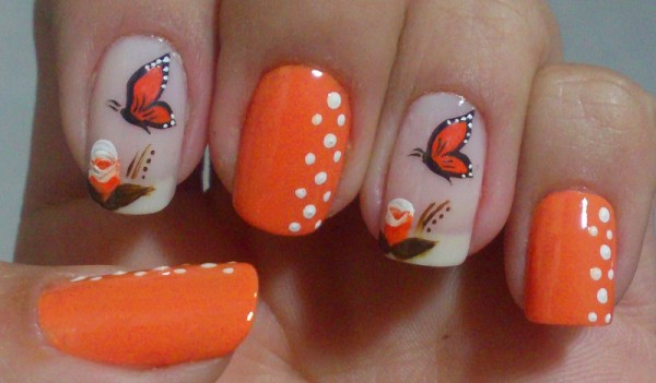 nail decorated with butterflies