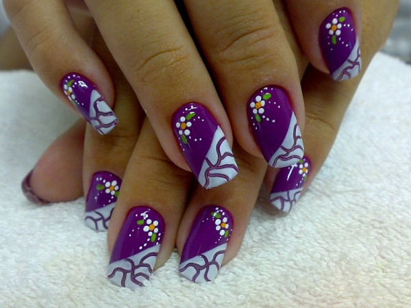 Beautiful nail model decorated with flowers