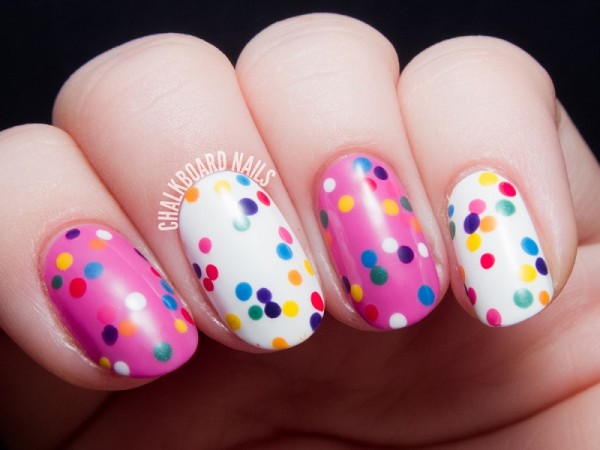 Nails decorated with colorful polka dots