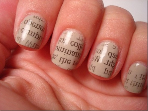 nail model decorated with newspaper