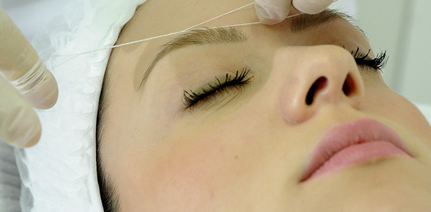 eyebrow waxing with thread