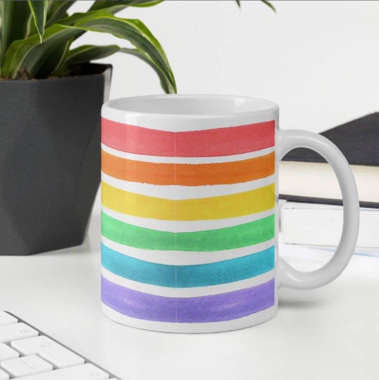 Mug with the colors of the LGBTQIA+ flag.