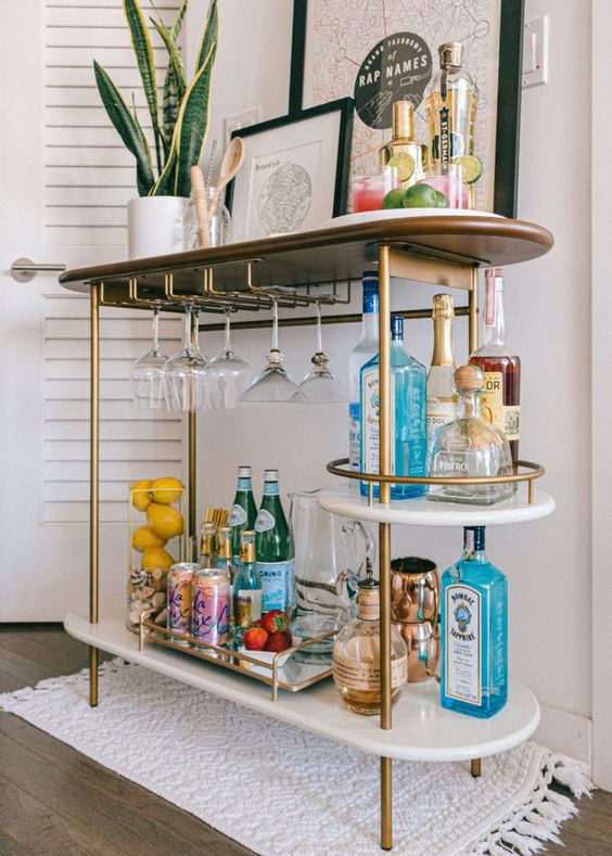 Small table with glasses and drinks.