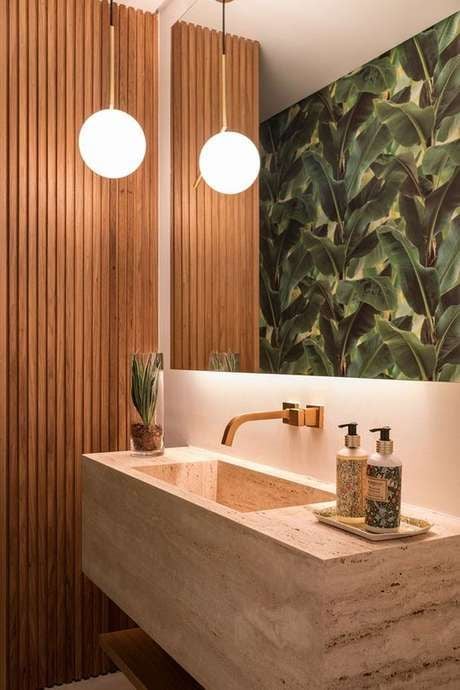 Bathroom with tropical wallpaper.