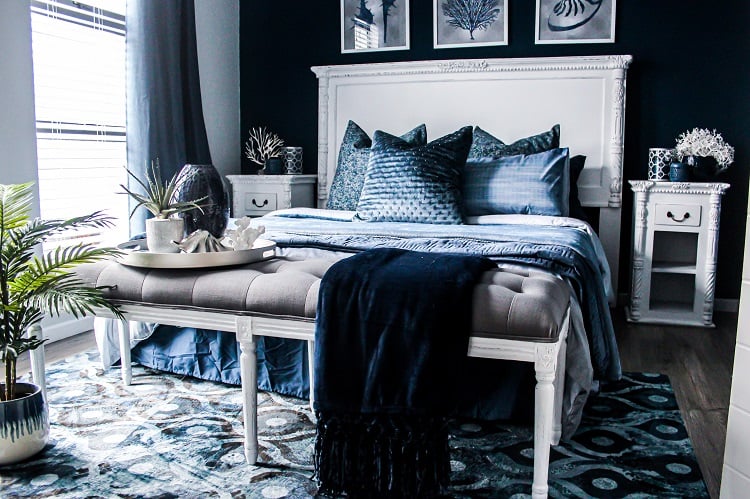 bedroom with black wall and bedding