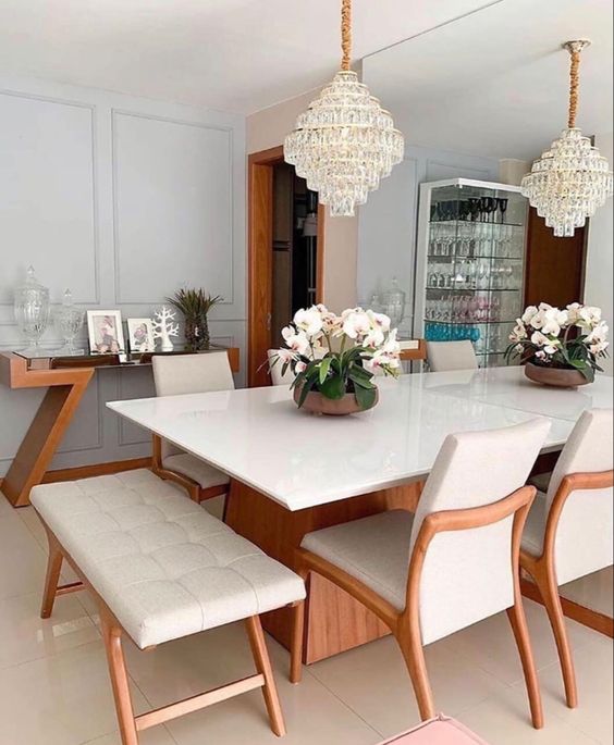 Dining room with chandelier and sideboard.