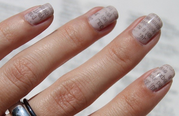 nails decorated with newspaper