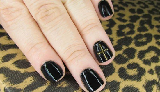 Nails decorated with cross