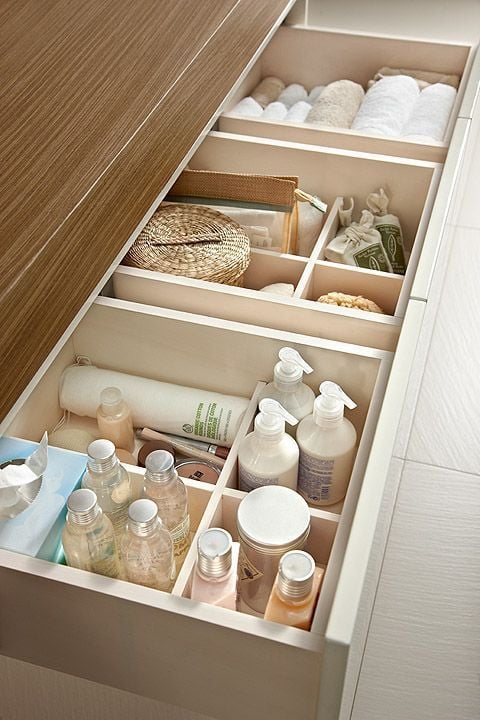 Drawer with wooden dividers.