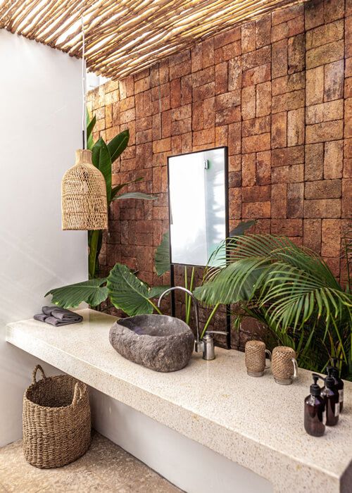 Bathroom with stone wall.