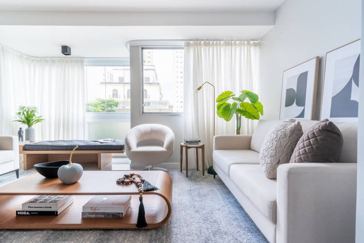 Living room with neutral colors and large windows.