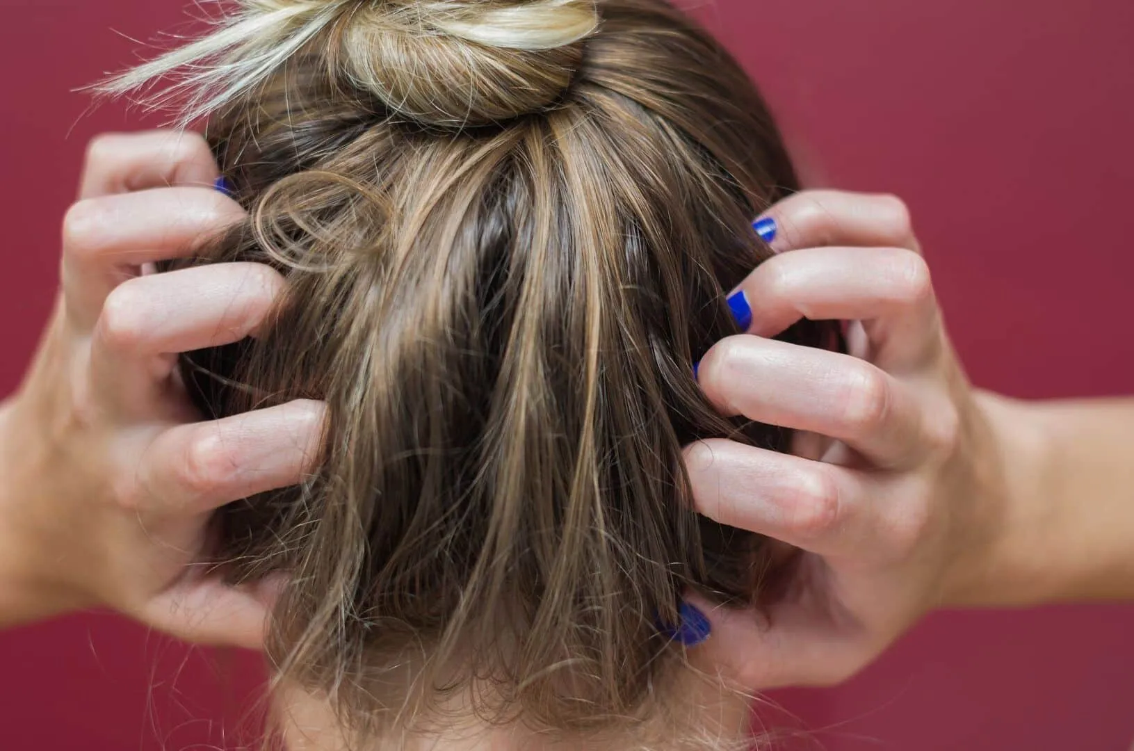 woman scratching her head