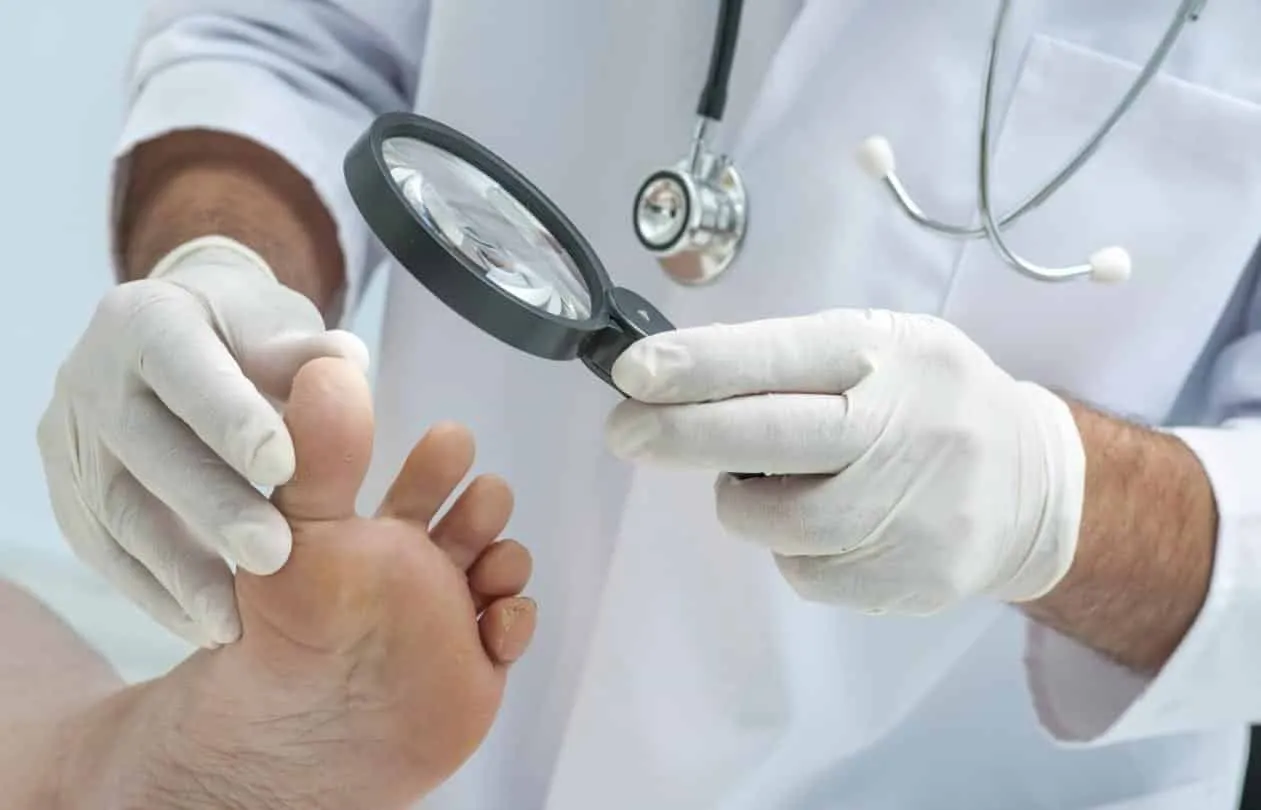 Podiatrist examining a foot