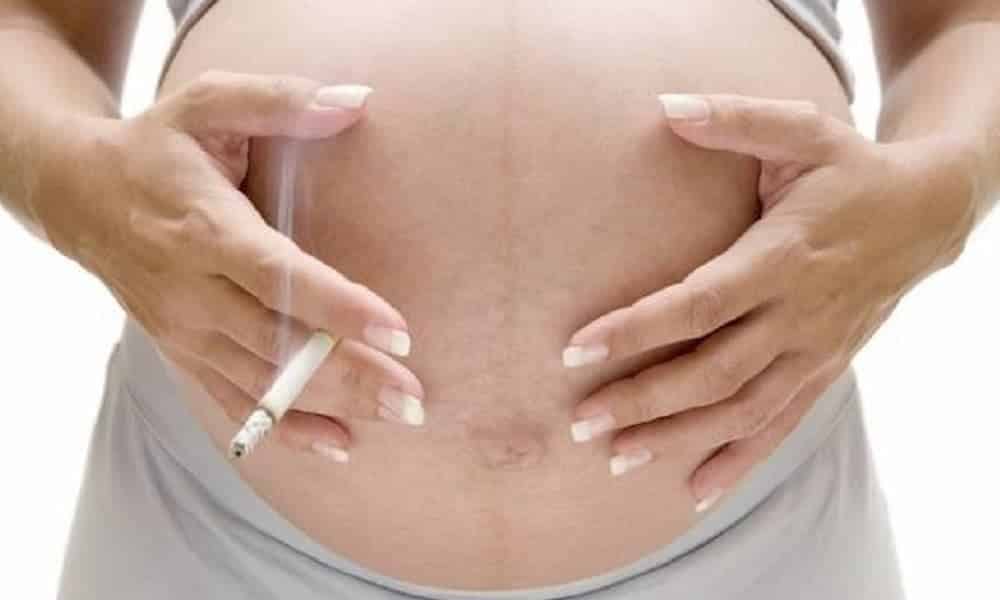 What happens if a pregnant woman smokes during pregnancy?