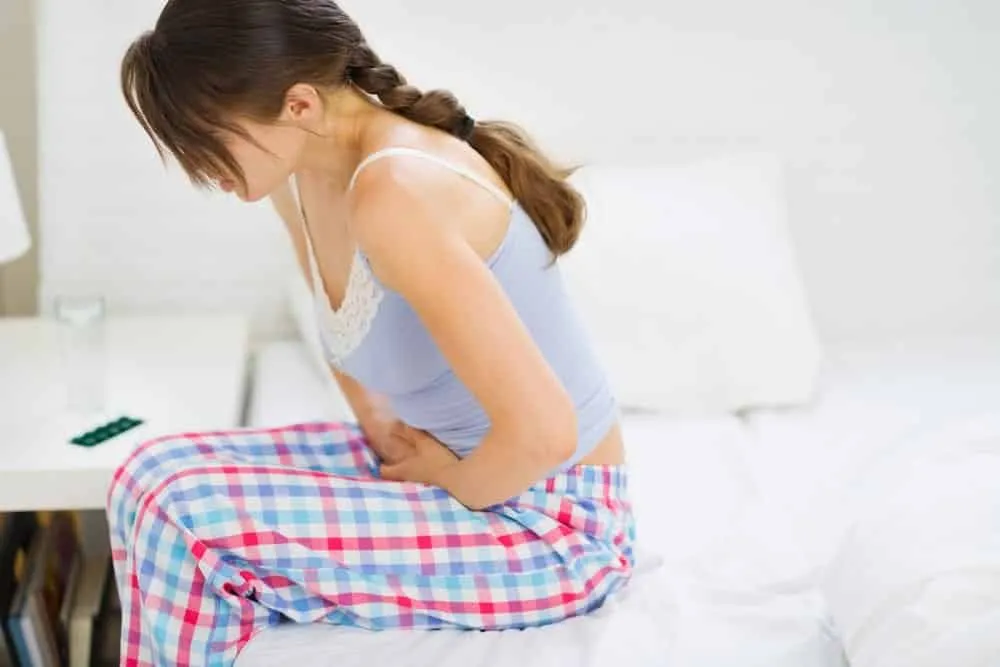 What does it mean when cramps appear outside of your menstrual period?