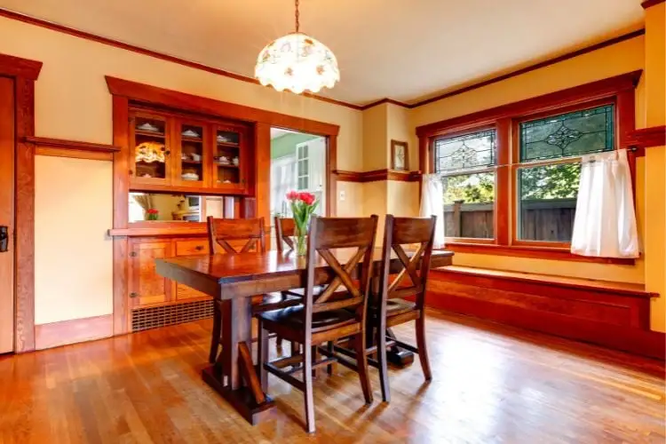 The dining room, with the floor and furniture, and rustic wood