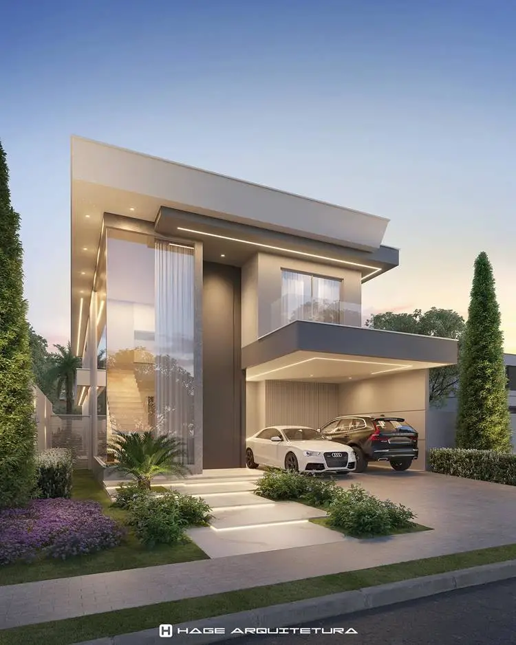 The facade of the home, moderna, straight lines and a clean, large glass windows and a garage for two cars. The house has a minimalist design with a neutral color. In the face of the house that is well maintained with grass, bushes, and tall trees, creating a perfect symmetry. Lighting, outside lighting to the front of the house, highlighting its architectural details. 