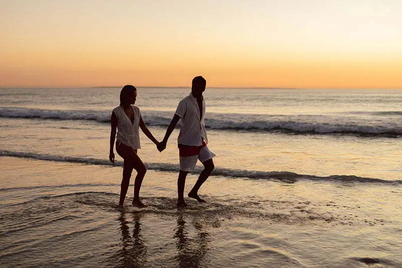 couple walking on the beach, in the state of Bahia