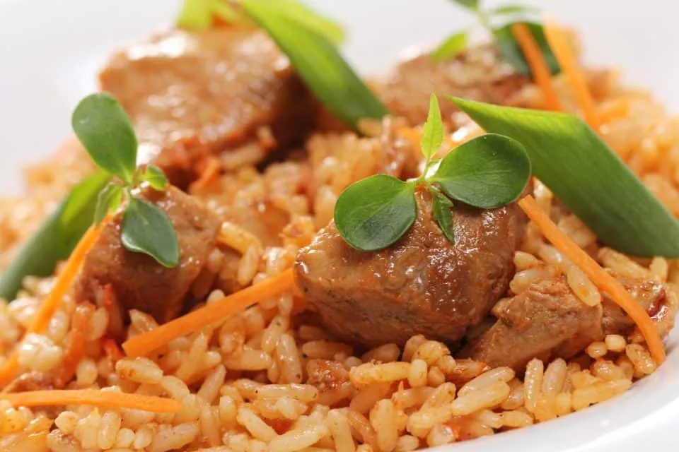 A dish of risotto, beef and arugula to serve at Sunday lunch